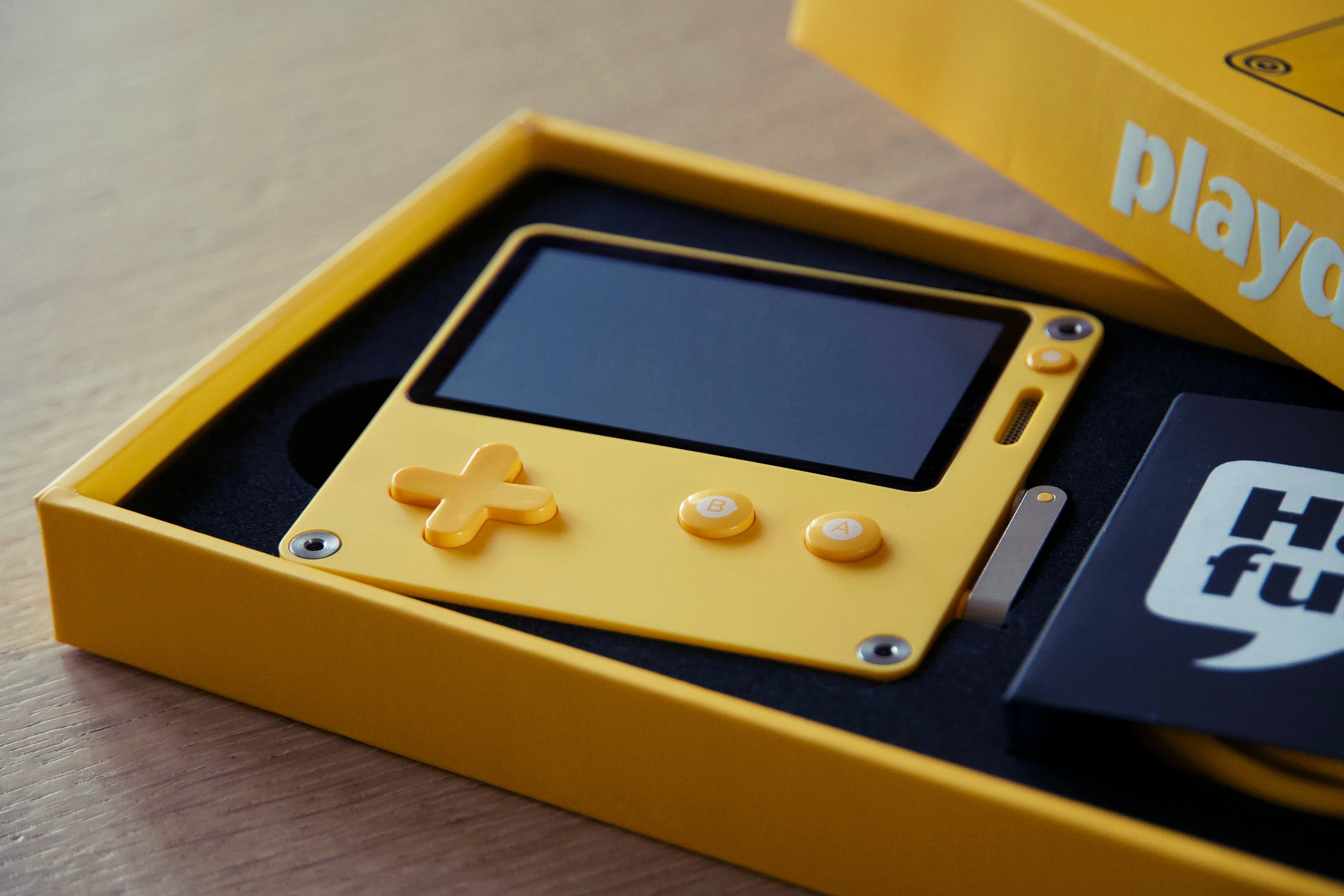 A playdate console in its packaging.
